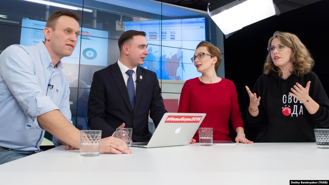 Navalny LIVE hosts Yelena Malakhovskaya (second from right) and Ivan Zhdanov in the studio along with opposition leader Aleksei Navalny (left) and presidential candidate Ksenia Sobchak (right)