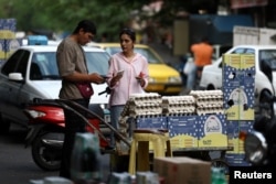 An Iranian woman shops in a local market in Tehran.