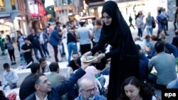 People break their fast on the first day of Ramadan near Taksim Square in Istanbul. While the west coast may be more liberal in its observation, further inland it is not the case.