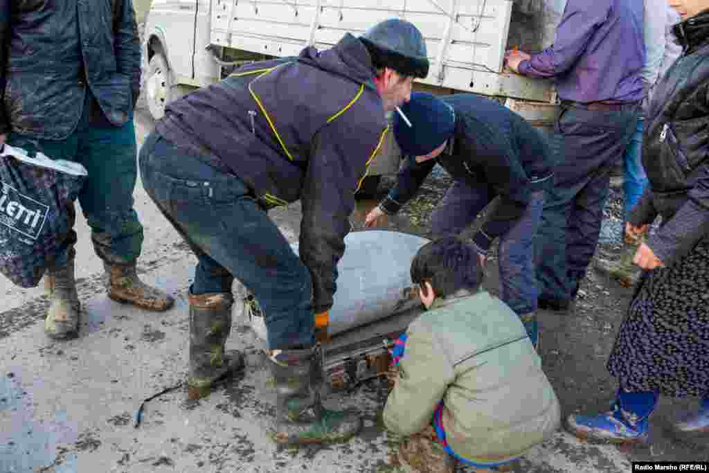 The sacks are weighed right away by middlemen who are on hand when the pickers emerge from the forests.