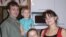 Irina Voropaeva (R) and family