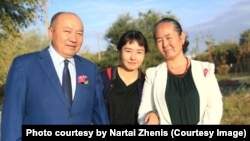 Zhengis Reskhan (left) with members of his family in an undated handout photo. 