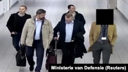 Four Russian citizens who allegedly attempted to hack the OPCW in The Hague are seen in this handout picture released on October 4.