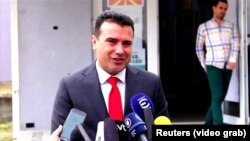 Macedonian Prime Minister Zoran Zaev speaks to journalists after casting his ballot on September 30.