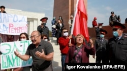 A group of protesters shout slogans urging people to vote against all parties during a rally in Bishkek ahead of upcoming parliamentary elections, which are scheduled for October 4. 