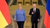 Германиянын канцлери Ангела Меркел жана Орусиянын президенти Владимир Путин.