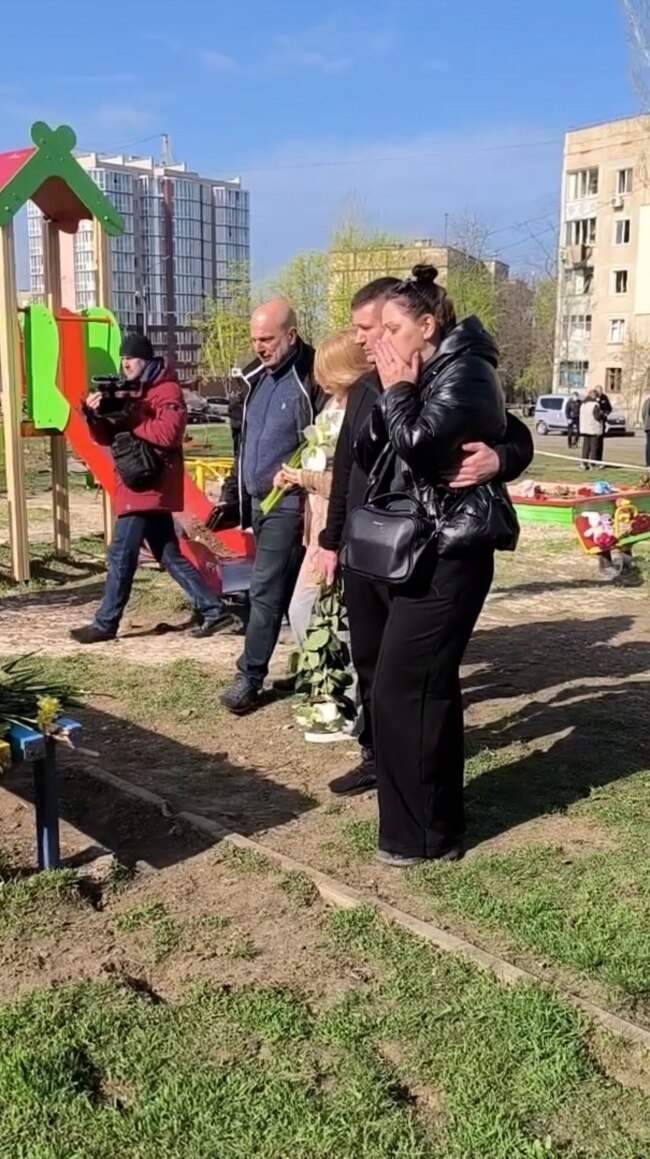 Mourners Leave Flowers, Toys For Victims Of Russian Strike In Kryviy Rih