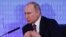 Russian President Vladimir Putin speaks during a session at the Week of Russian Business, organized by the Russian Union of Industrialists and Entrepreneurs in Moscow, on February 9.