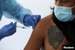 Вакцинация в Сантьяго, Чили, март 2021 года. Фото: Reuters