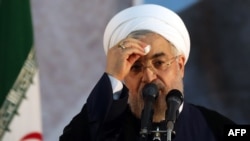 Iranian President Hassan Rohani delivers a speech on the eve of the 25th anniversary of the Islamic revolutionary leader Ayatollah Ruhollah Khomeini's death, at his mausoleum in a suburb of Tehran, on June 3.