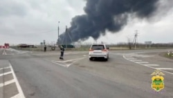 Ukraine -- Black smoke rises from the site of fire following an explosion at an oil depot