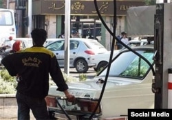 A man fills his car with gas in Tehran. (file photo)