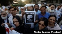 FILE: Journalists protest in Karachi Pakistan in February.