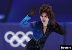 Михаил Шайдоров олимпиадада өнер көрсетіп жатқан сәт. Милан. 13 ақпан 2026 жыл.