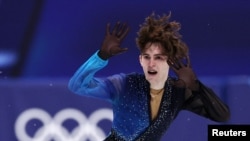 Михаил Шайдоров во время выступления в произвольной программе. Милан, 13 февраля 2026 года