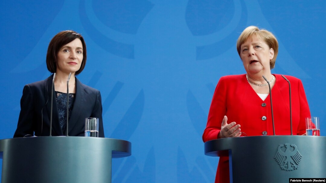 Moldovan Prime Minister Maia Sandu (left) and German Chancellor Angela Merkel attend a joint news conference at the Chancellery in Berlin on July 16.