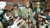 Chechen guerrilla leader Shamil Basayev (center) gives a press conference on June 15, 1995, as he and his fighters hold hostage more than 1,500 residents in the city hospital in Budyonnovsk demanding then withdrawal of Russian troops from then-breakaway Chechnya.