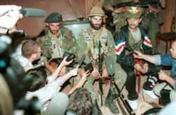 Shamil Basayev (center) gives a press conference on June 15, 1995, after he and his fighters took over 1,500 hostages in Budyonnovsk.