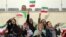 IRAN -- Iranian women cheer during the friendly football match between Iran and Bolivia at the Azadi Stadium in Tehran, October 16, 2018