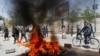 Protesters set a fire during a protest in Kabul on June 2.