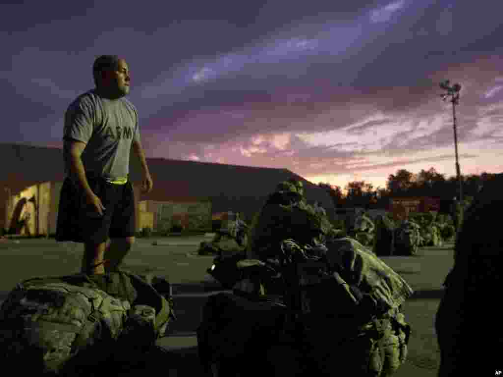 A U.S. soldier waits to have his luggage checked by U.S. Customs at the Transit Center in Manas, Kyrgyzstan, while continuing home after leaving Afghanistan upon completing a deployment on Aug. 8. The 4th Brigade Combat Team, 101st Airborne Division, is returning home after a year in Afghanistan as the last brigade to deploy as part of President Barack Obama's 30,000-troop surge. Photo by David Goldman for AP