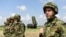 Serbian soldiers stand near a Chinese-made FK-3 medium-range missile syste during the "Shield 2022" military exercises in Batajnica, near Belgrade, in April 2022. 