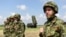 Serbian Army soldiers stand near the Chinese medium-range missile system FK-3, the latest weapon received by the Serbian Army, during a demonstration of Serbian Army's air defence capabilities, "Shield 2022", at the military airport "Colonel-pilot Milenko Pavlovic" in Batajnica, near Belgrade, Serbia, April 30, 2022