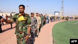 Voluntari la o tabără de instruire din Basra, Irak, 18 iunie 2014.