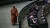 An Iranian cleric lawmaker walks at the parliament during a memorial, in Tehran, Iran, Wednesday, May 21, 2025