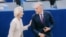 TOPSHOT - This handout photograph taken and released by the European Union on September 16, 2026 shows European Commission President Ursula von der Leyen (L) greeting Canada's Prime Minister Mark Carney during her annual keynote address to the European Pa