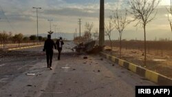 IRAN -- Aphoto made available by Iran state TV (IRIB) shows the damaged car of Iranian nuclear scientist Mohsen Fakhrizadeh after it was attacked near the capital Tehran, November 27, 2020