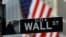 U.S. -- Raindrops hang on a sign for Wall Street outside the New York Stock Exchange in Manhattan in New York City, New York, U.S., October 26, 2020. 