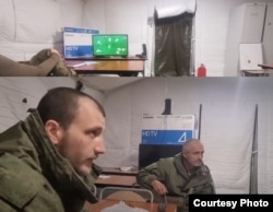 The photo above by Dragan shows a tent used by Serbian mercenaries at the Alabino training ground; the photo below is a still from a video by Dejan Beric.