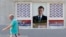 Muškarac prolazi pored plakata sa likom Aleksandra Vučića, lidera Srpske napredne stranke i predsednika Srbije, na jednoj zgradi u Beogradu jula 2021.