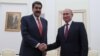 Russian President Vladimir Putin (right) and Venezuelan President Nicolas Maduro meet at the Kremlin in Moscow on September 25.