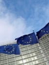 FILE PHOTO: EU flags fly outside the European Commission in Brussels