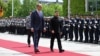 German Chancellor Friedrich Merz walks with Ukrainian President Volodymyr Zelenskiy at the Chancellery in Berlin on May 28.