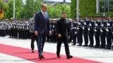 German Chancellor Friedrich Merz walks with Ukrainian President Volodymyr Zelenskiy at the Chancellery in Berlin on May 28.