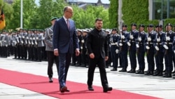 German Chancellor Friedrich Merz walks with Ukrainian President Volodymyr Zelenskiy at the Chancellery in Berlin on May 28.