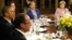 U.S. President Barack Obama (left) is joined by France's Francois Hollande (bottom), Britain's David Cameron (second left), Russia's Dmitry Medvedev (center), and Germany's Angela Merkel at a working dinner at Camp David on May 18.