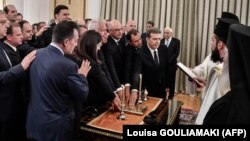 GREECE -- Greece's newly appointed members of the government swear-in during an appointment ceremony at the presidential palace in Athens on July 9, 2019. - Greece's new prime minister, Kyriakos Mitsotakis, formally takes up the reins on July 8, a day aft