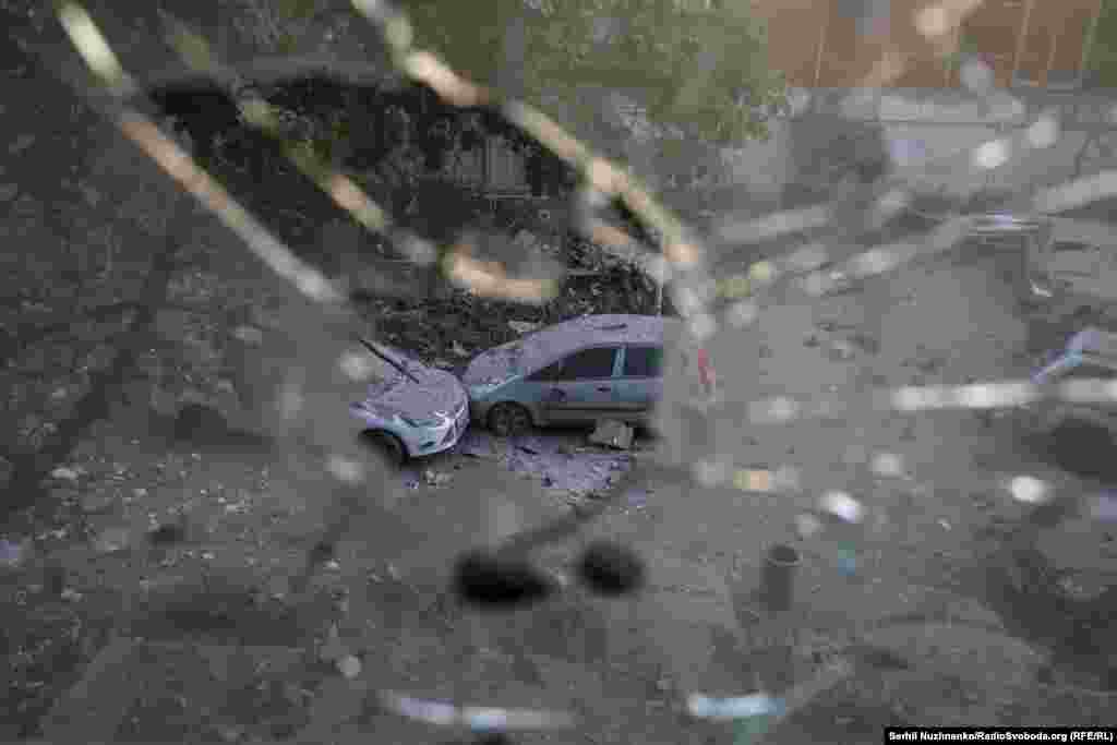 Rubble-covered cars in Kyiv