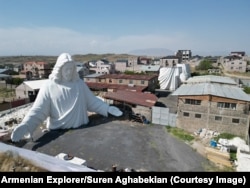 All three sections of the aluminum statue at the open-air workshop in Zovuni