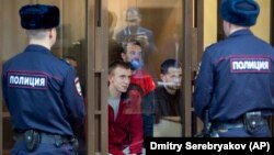 Some of the sailors captured in a Russian attack on Ukrainian naval vessels attack near the Kerch Strait attack in November appear in court in Moscow on February 12.