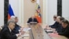 Russian President Vladimir Putin (center) chairs a Security Council meeting in Moscow on September 25. 