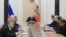 Russian President Vladimir Putin (center) chairs a Security Council meeting in Moscow on September 25. 