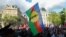 A protester holds the flag of New Caledonian nationalists at a demonstration in Paris on May 16.
