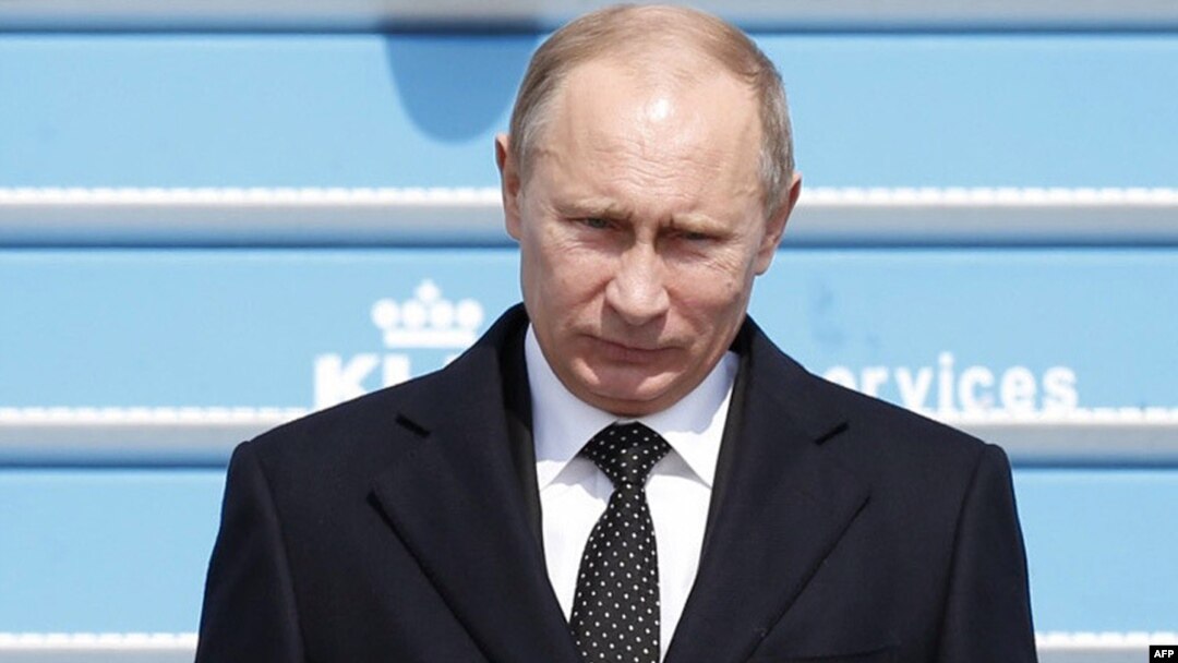 Russian President Vladimir Putin arrives at Schiphol Airport near Amsterdam on April 8.
