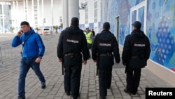 Russia -- Security guards patrol at the Olympic Park in Adler near Sochi, January 16, 2014