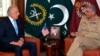 U.S. peace envoy Zalmay Khalilzad (left) talks with Pakistani Army Chief General Qamar Javed Bajwa in 2018.